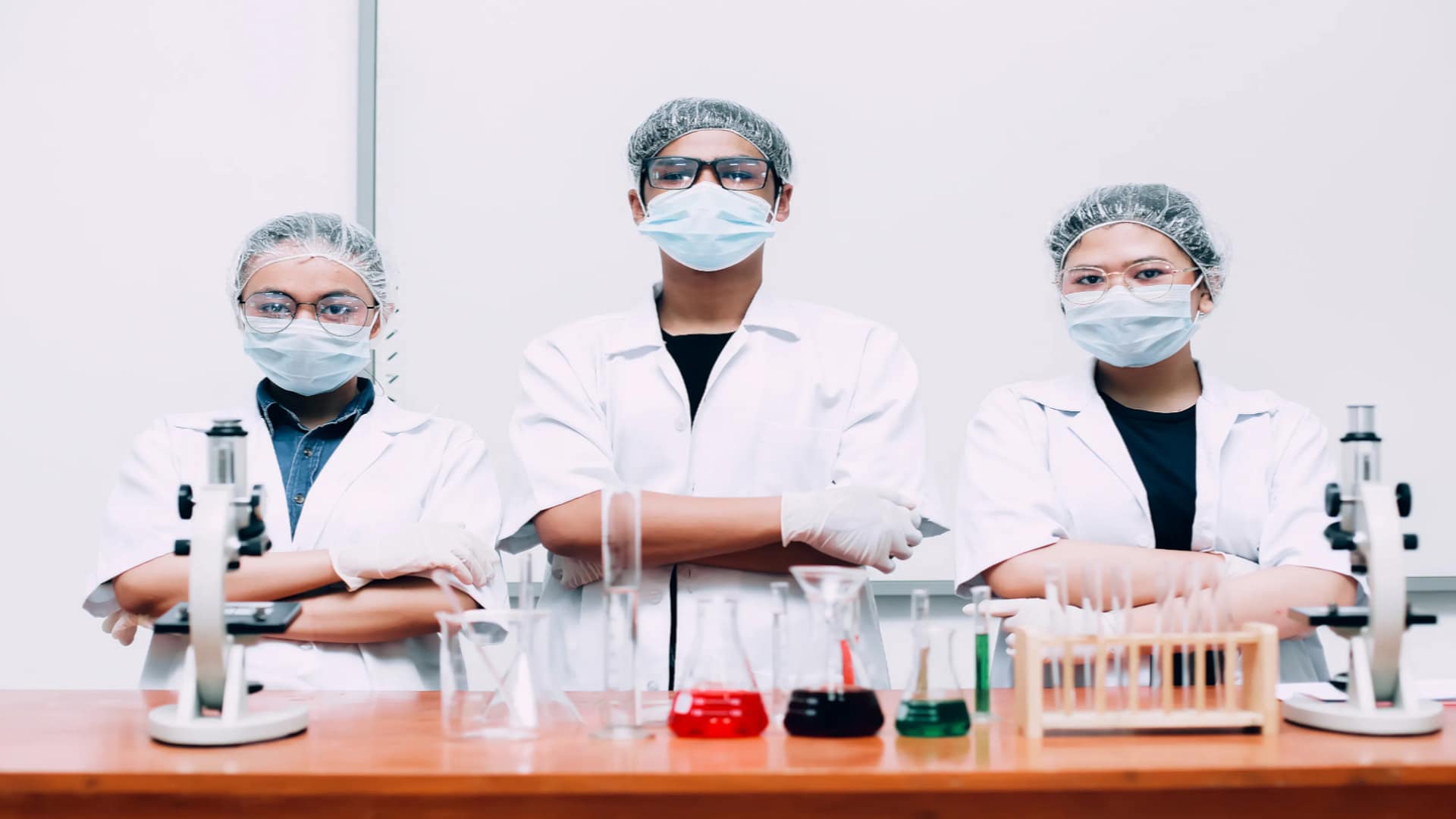 group-of-scientists-wearing-protective-masks-and-uniform-posing-with-confidence-by-gatot-adriansyah-from-vecteezy