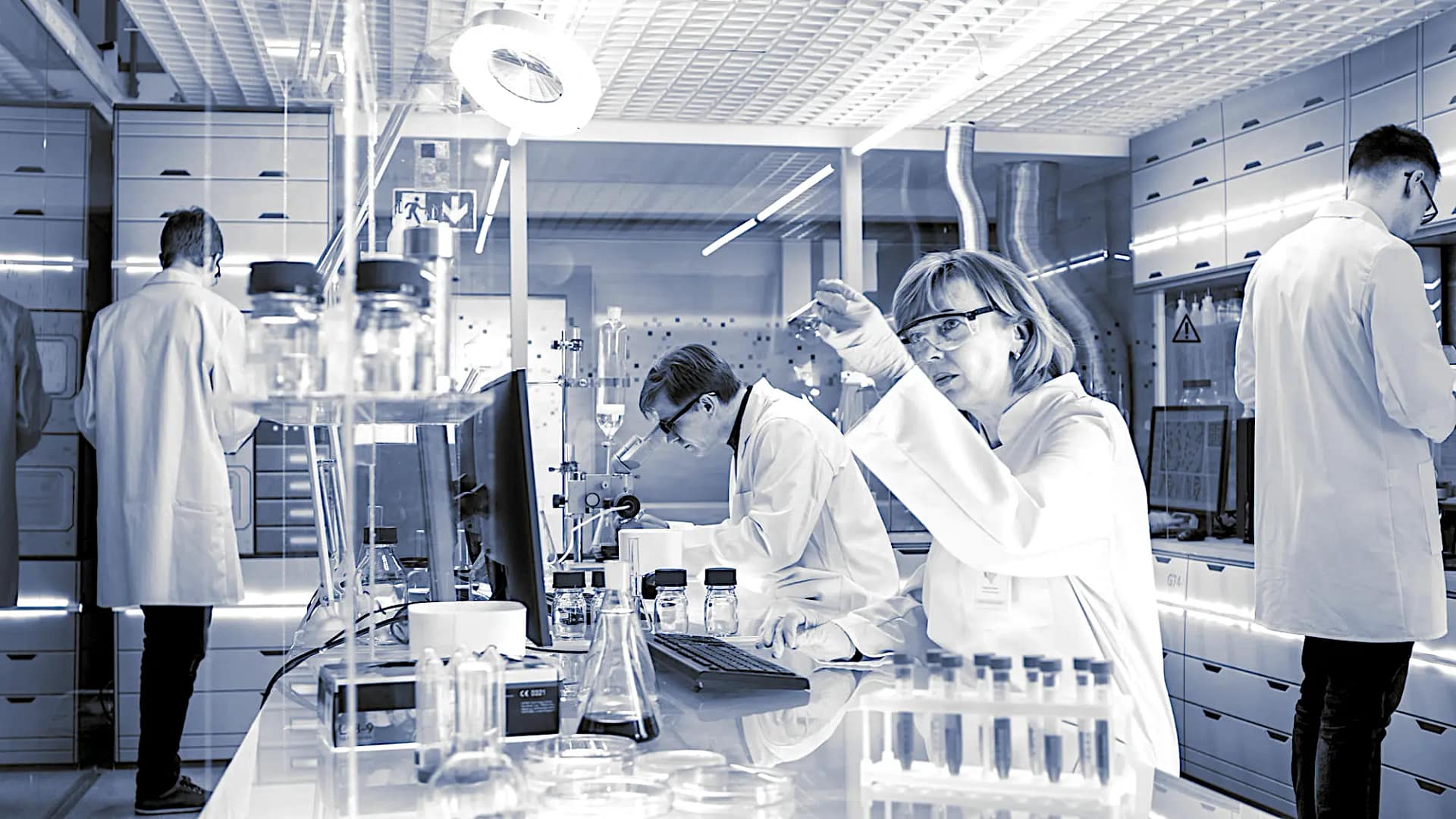 scientist-working-vigorously-in-a-lab-from-chemistry-world---black-&-white