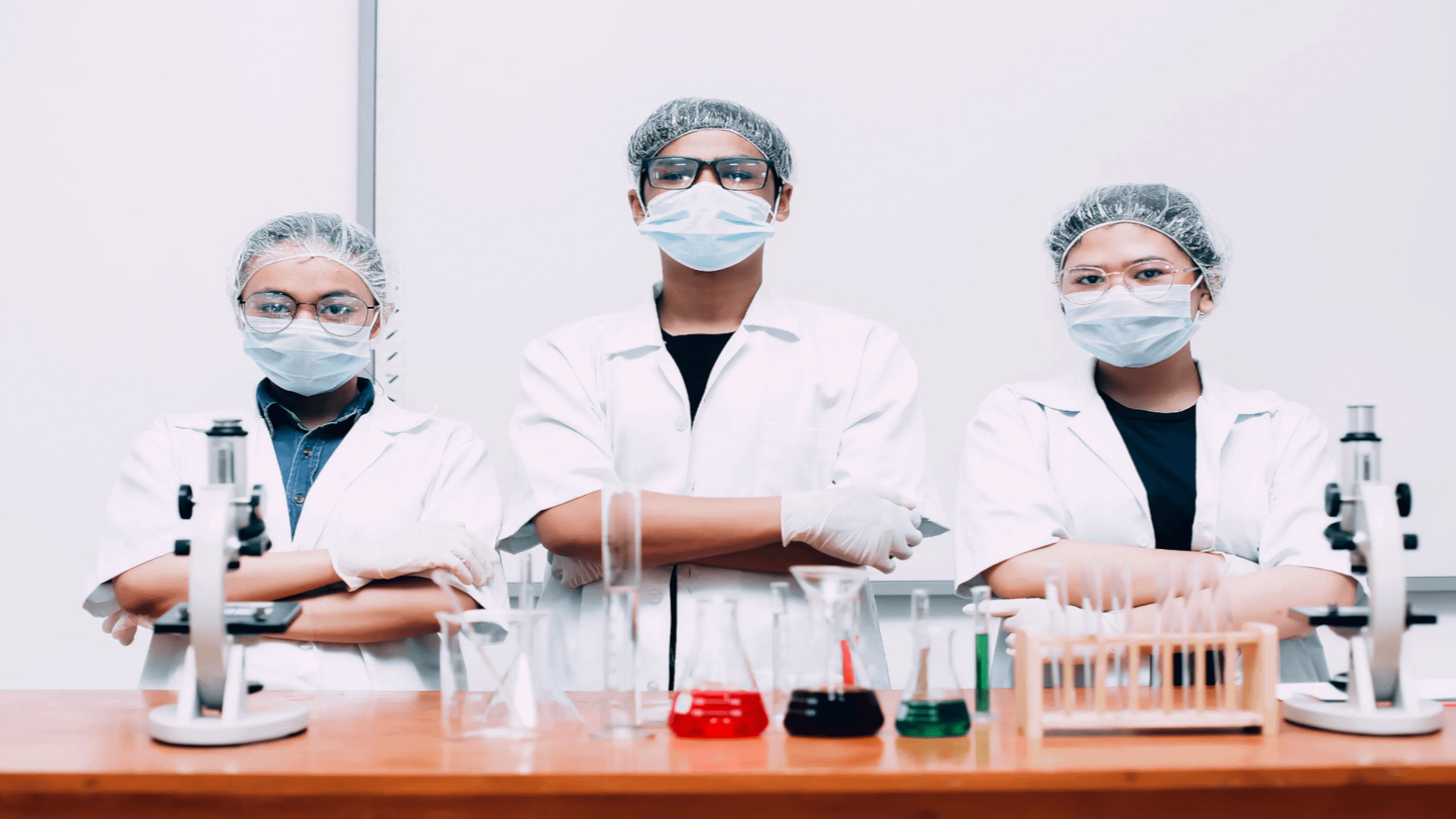 group-of-scientists-wearing-protective-masks-and-uniform-posing-with-confidence-by-gatot-adriansyah-from-vecteezy