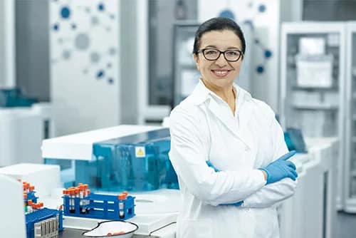cheerful-senior-female-scientist-posing-proudly-at-her-lab-by-nestor-from-adobe-stock